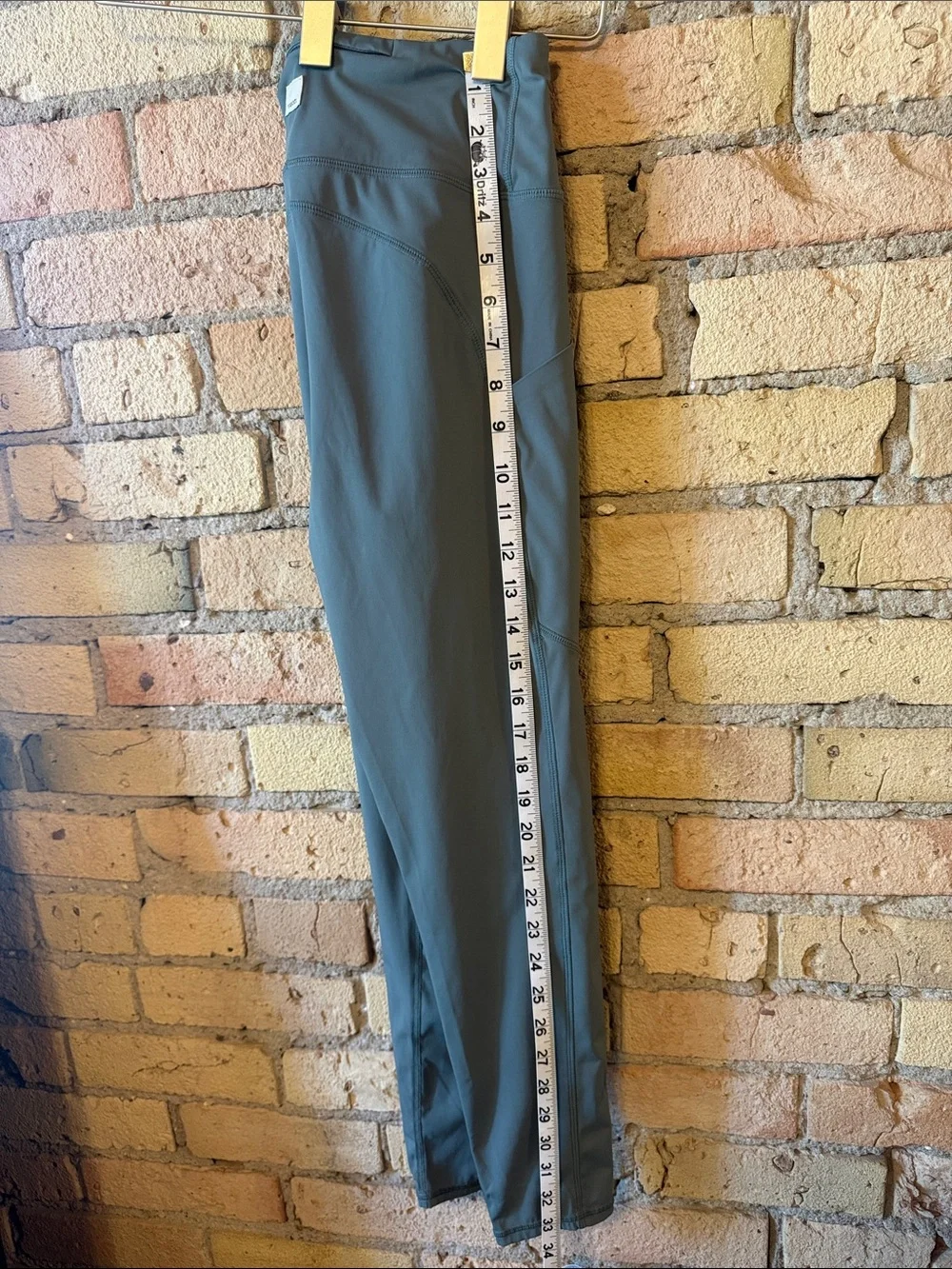 Vuori High-Waist Performance Leggings - Slate Blue with zipper pocket on back